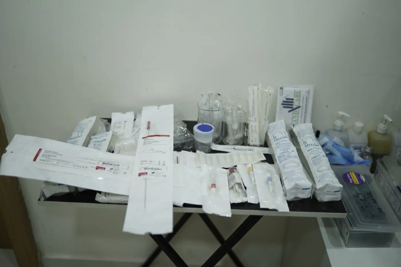 Sterile single-use ART consumables — embryo transfer catheters, aspiration needles, culture dishes — prepared at Aansh IVF